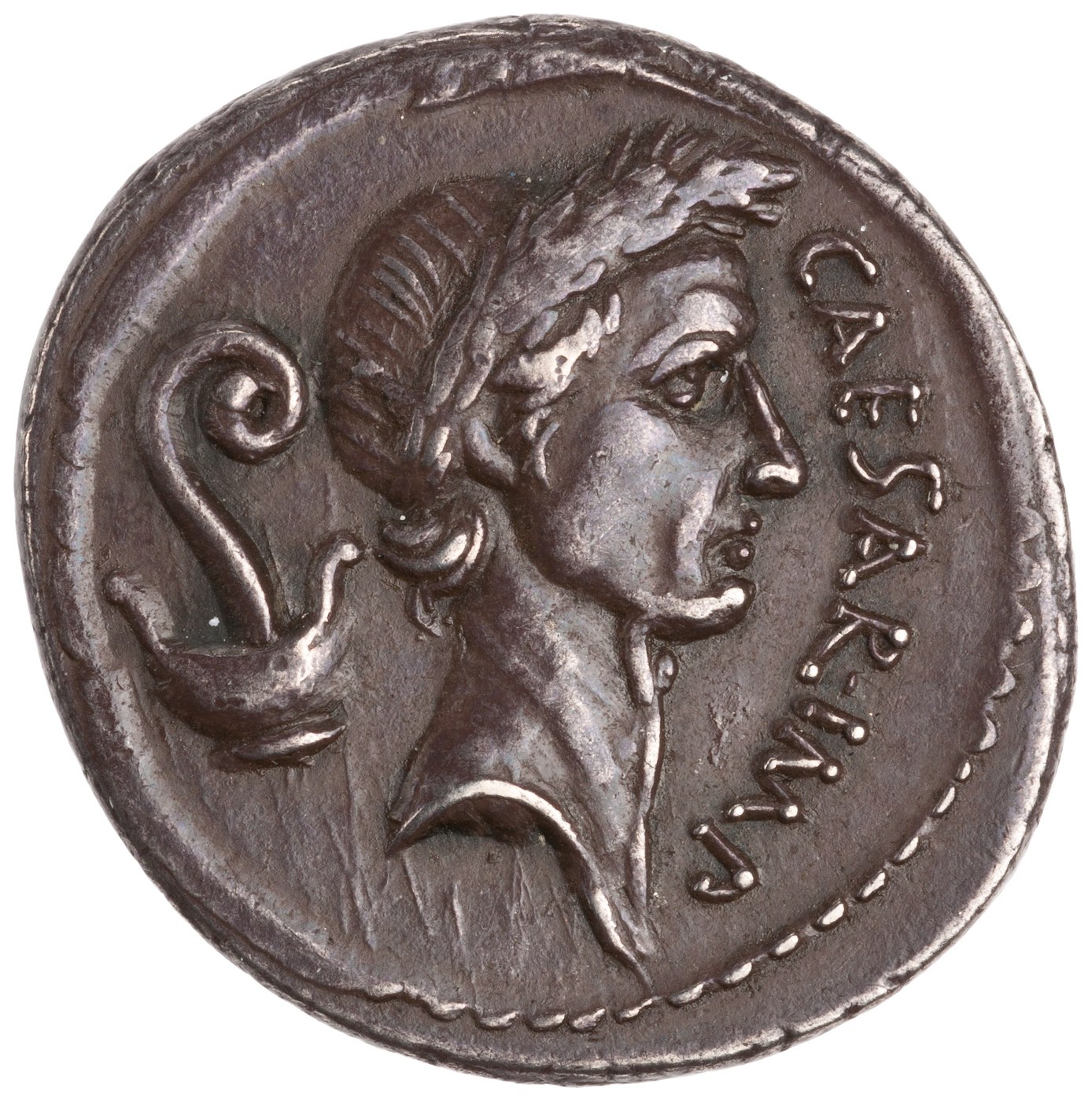 Silver denarius with the portrait of Caesar and the title dictator perpetuo